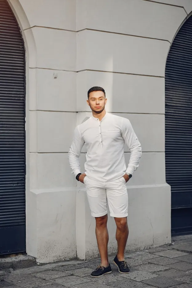 For Classic Safari Suits: Pair a classic safari suit with a button-down shirt in a solid color, such as white, light blue, or beige. You can also add a tie or bow tie for a more formal look.