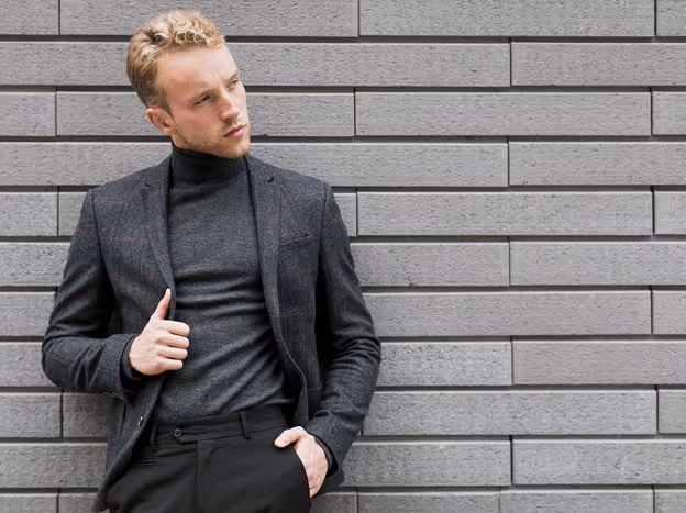 A fused jacket is constructed by bonding the outer fabric to a lightweight interfacing using heat and adhesive. This method is cost-effective and commonly used in more affordable suits.